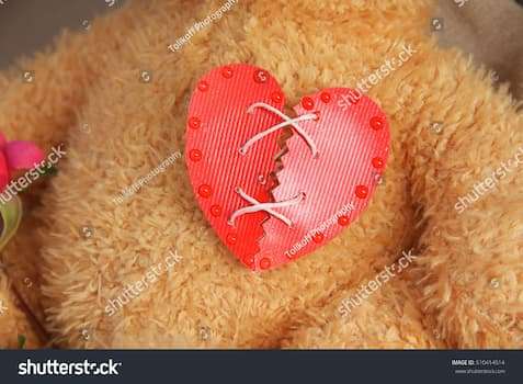 stock-photo-repaired-broken-red-heart-on-the-chest-of-teddy-bear-510414514 (1)
